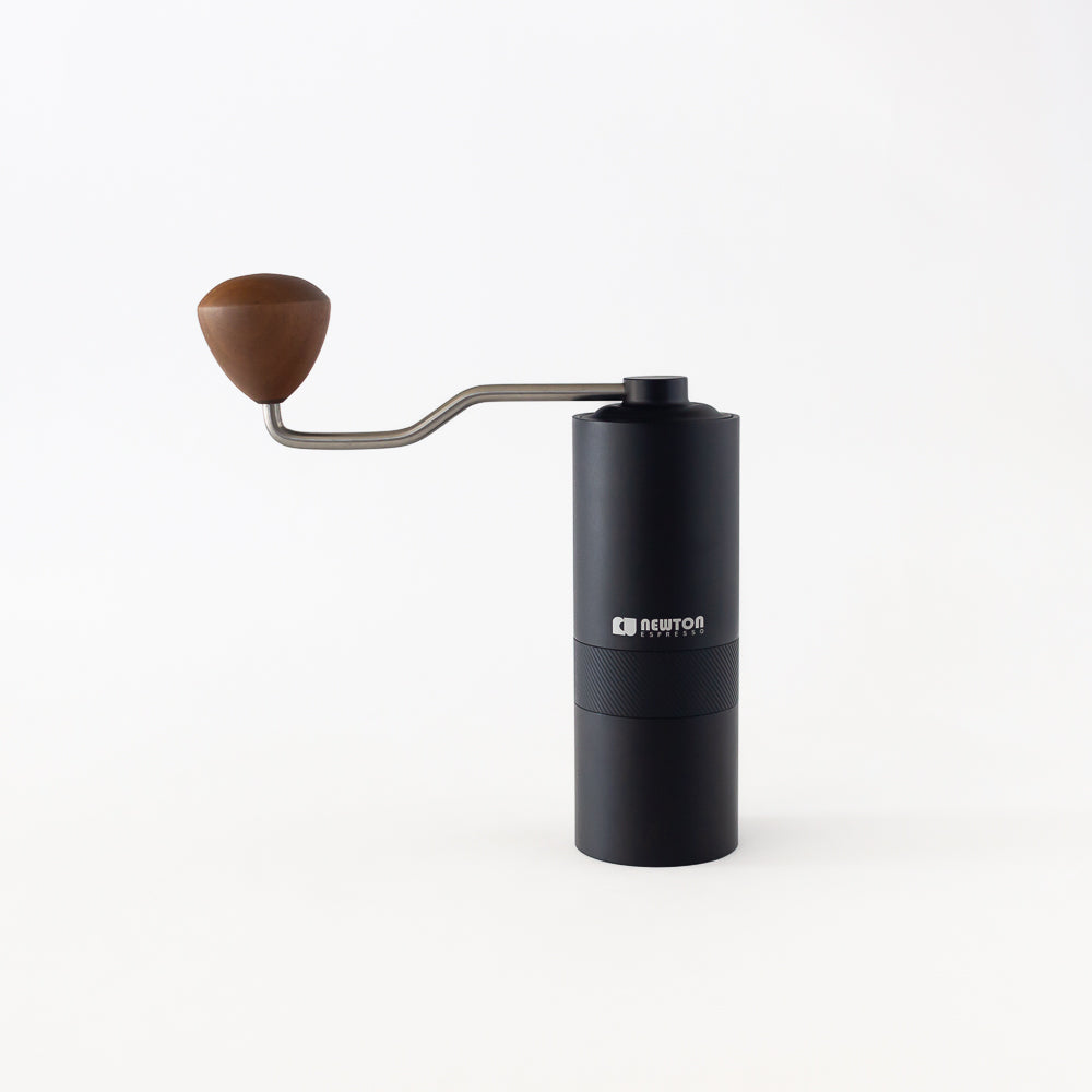 Studio shot of hand operated manual coffee grinder