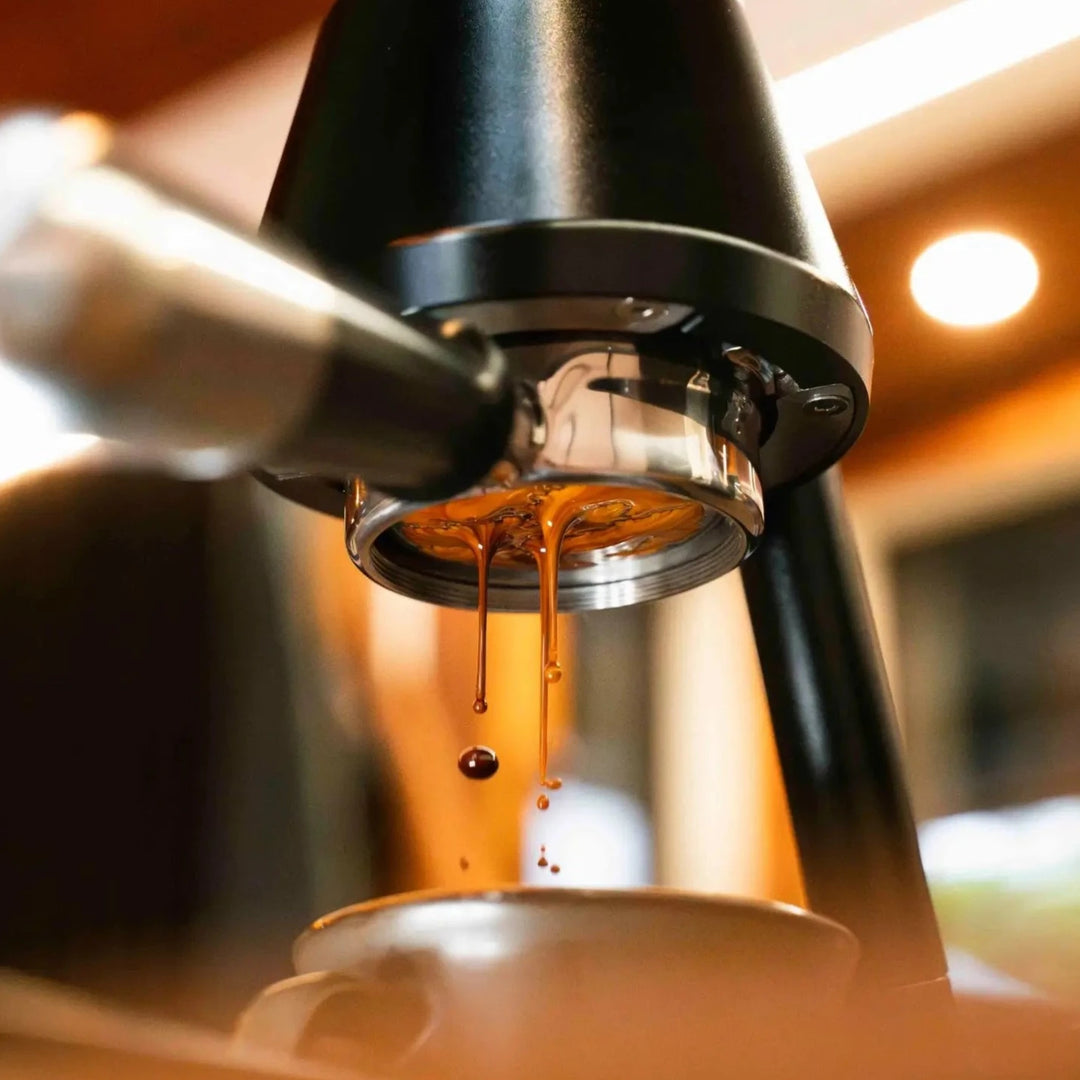 Coffee extracting from a non-electric lever espresso machine.