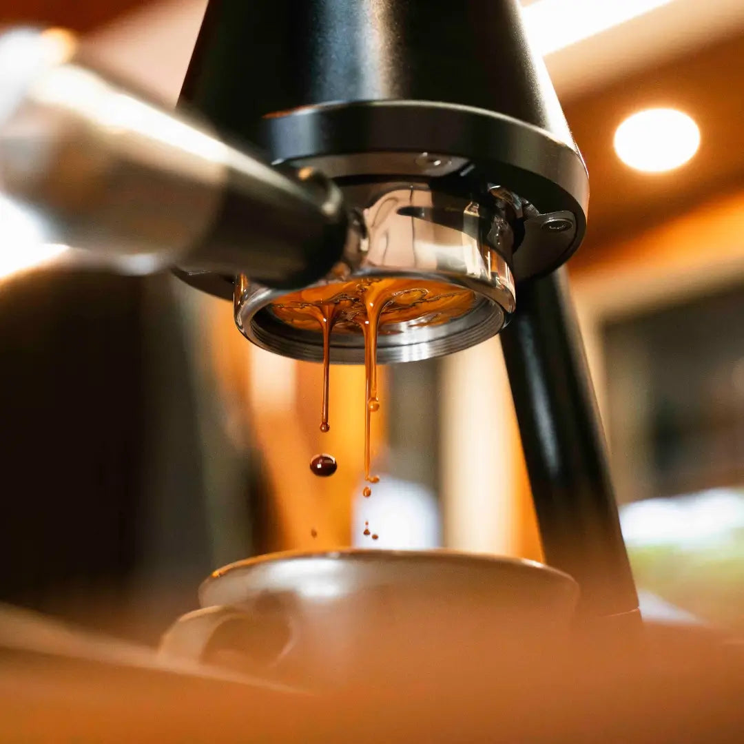 Espresso dripping from bottomless portafilter